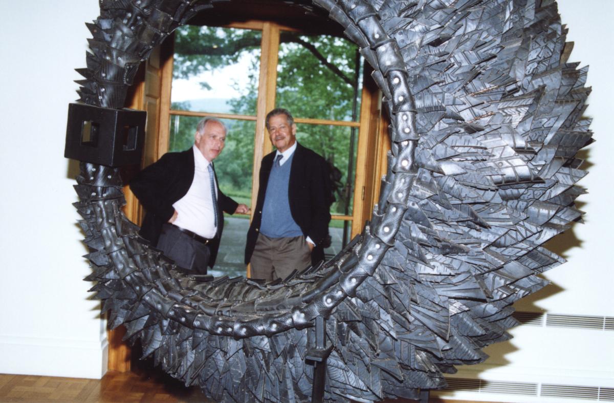 David Collens and H. Peter Stern with a sculpture by Chakaia Booker, 2003. 