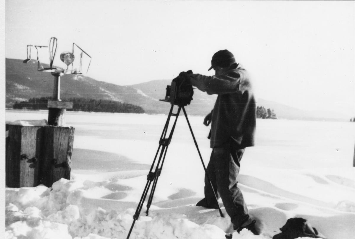 <em>David Smith photographing “Oculus” on dock at Bolton Landing</em>, 1945