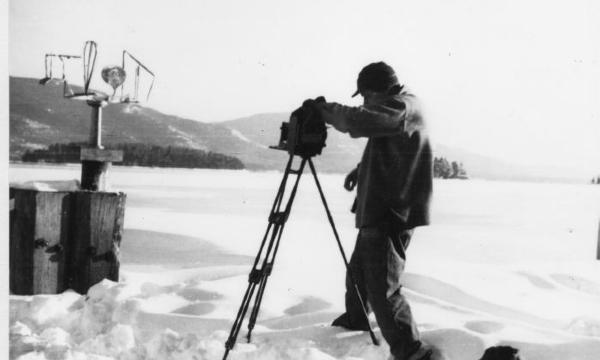 <em>David Smith photographing “Oculus” on dock at Bolton Landing</em>, 1945